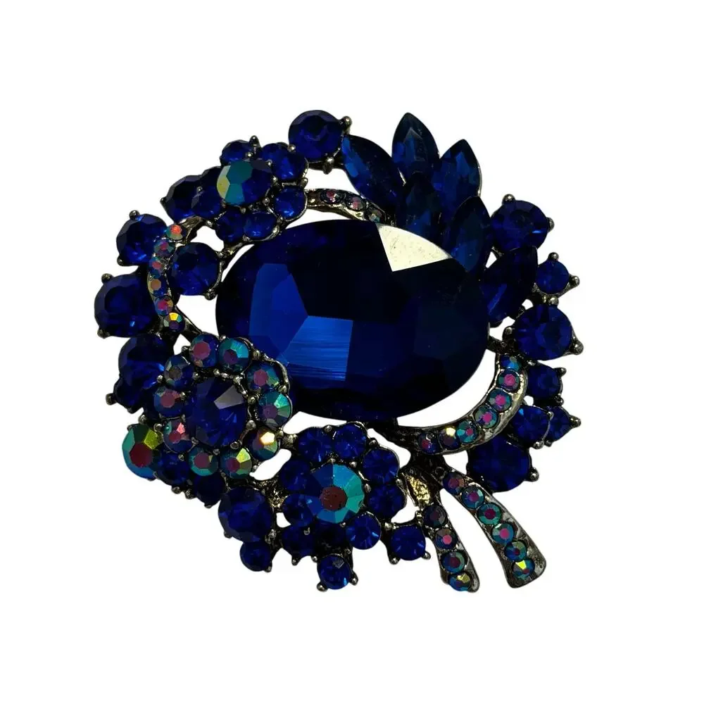 Vintage inspired chunky blue rhinestones brooch ornate silvertone AB finish